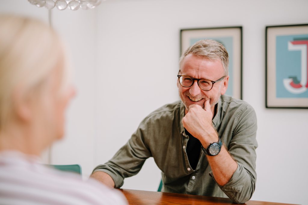 Smiling older man in office
